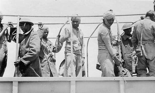 British_indian_and_sikh_colonial_pow_in_afrika_korps_truck.jpg