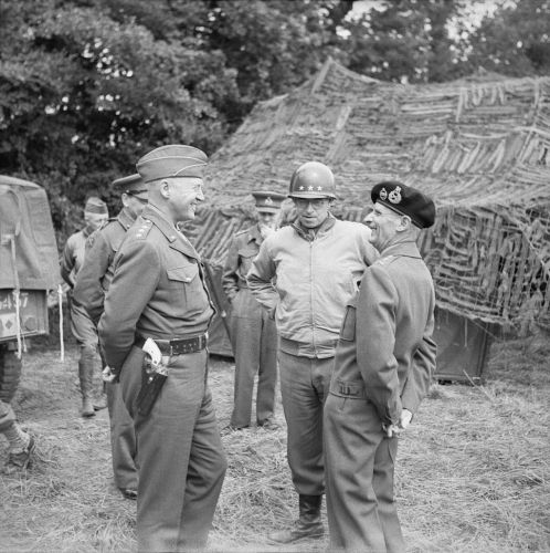 General_Montgomery_with_Generals_Patton_(left)_and_Bradley_(centre)_at_21st_Army_Group_HQ,_Normandy,_7_July_1944__B6551.jpg
